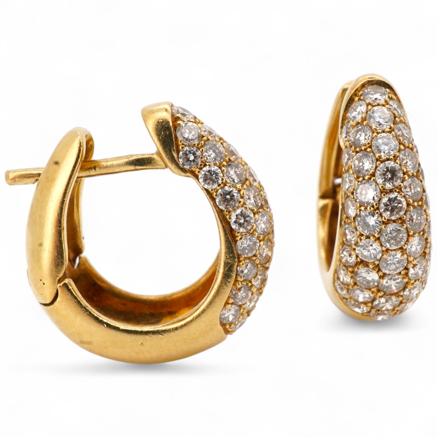 A pair of diamond sleeper earrings, of hinged design, the fronts pavé-set with brilliant-cut diamonds totalling approximately 0.80 carats, length 1.6cm each, post fittings, combined gross weight 6.5 grams